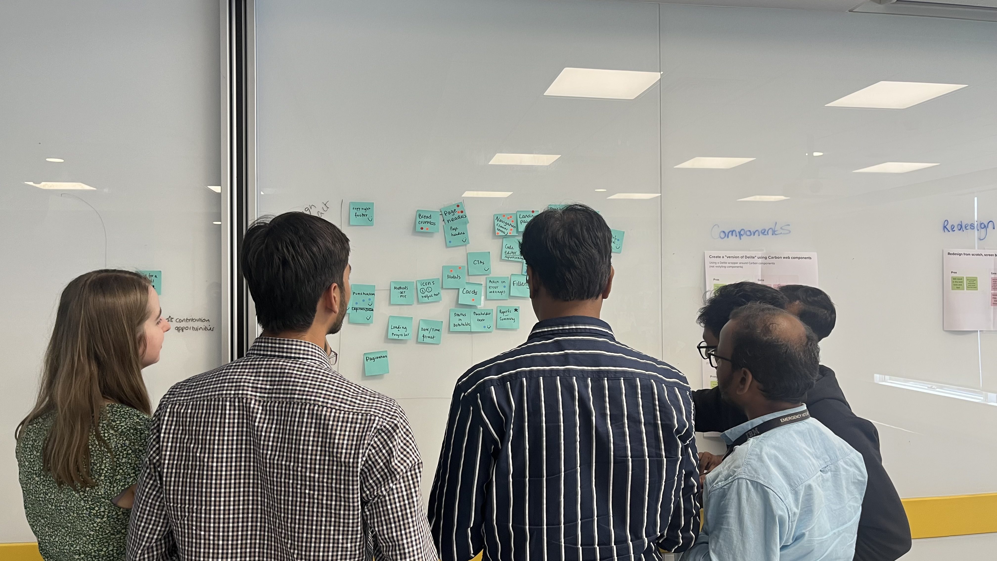 Workshop activity — teams working through product-specific migration decisions together.